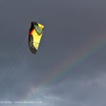 Paraglider and rainbow